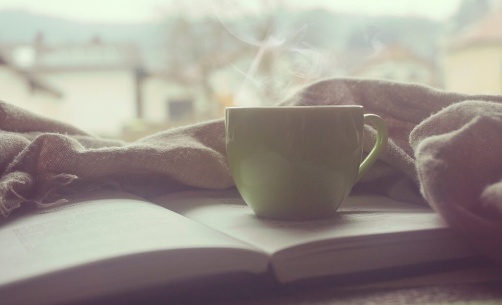 relaxing image of coffee cup and book