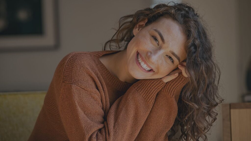 woman smiling after medspa services